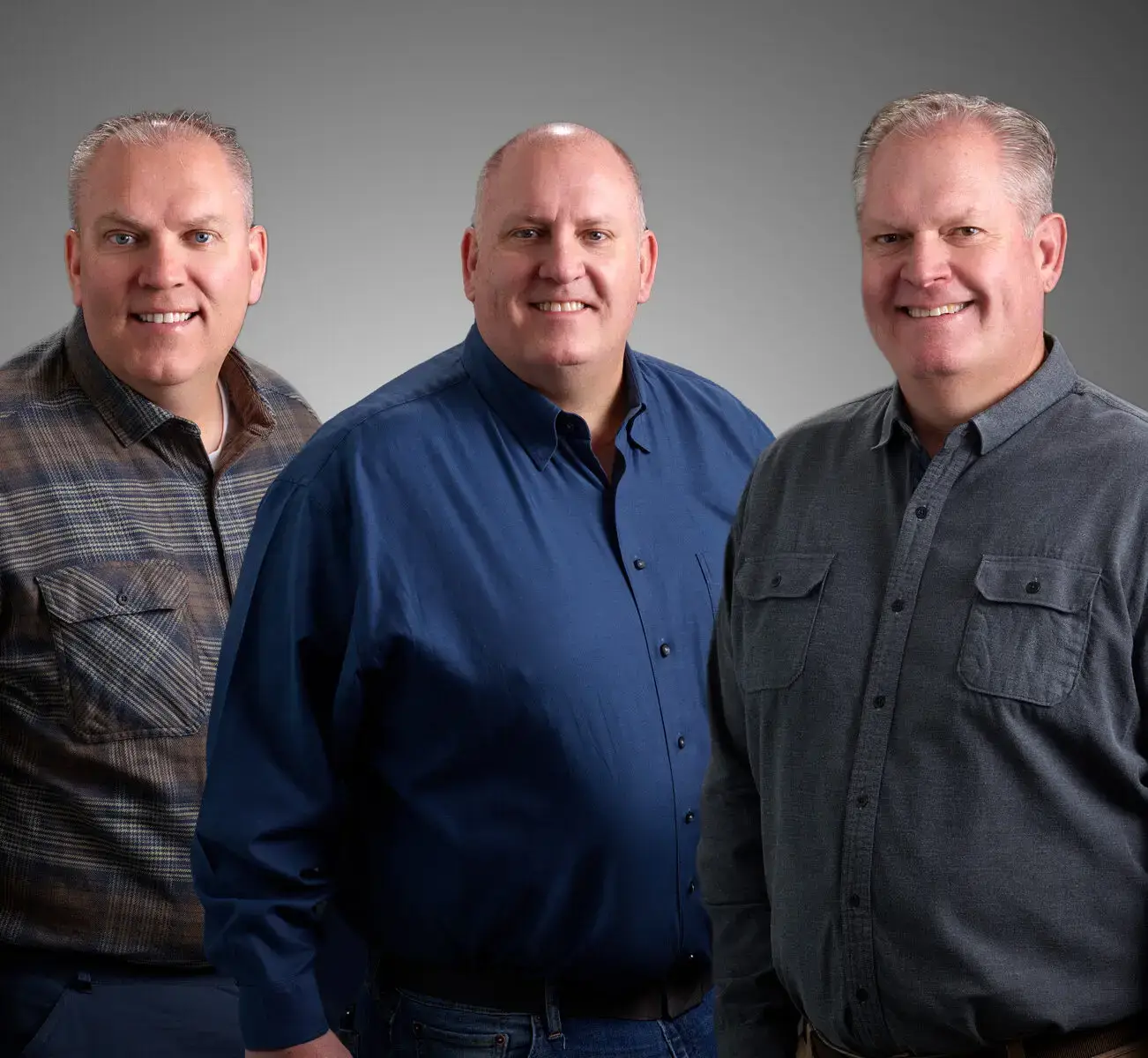 Photo of Brandon, Ryan, and Chris Quinton of Cameo Homes standing together